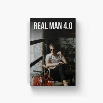 Man sitting with drink, "Real Man 4.0".